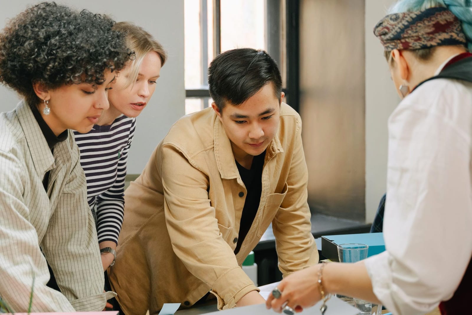 Team reviewing a project together around a table