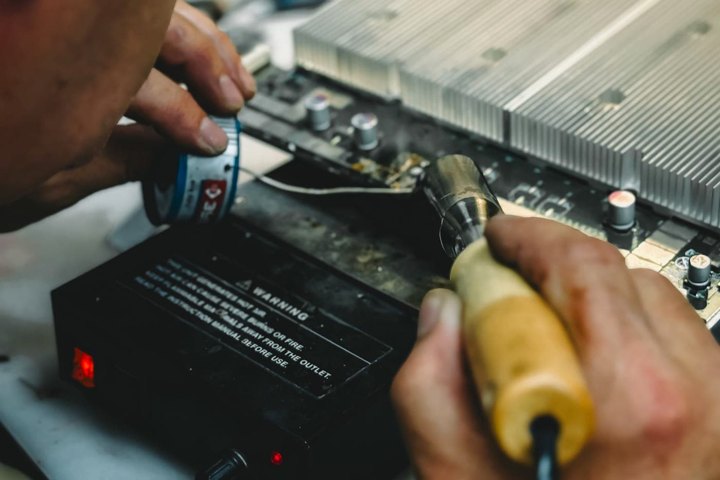 Engineer working on electronic equipment during a service visit