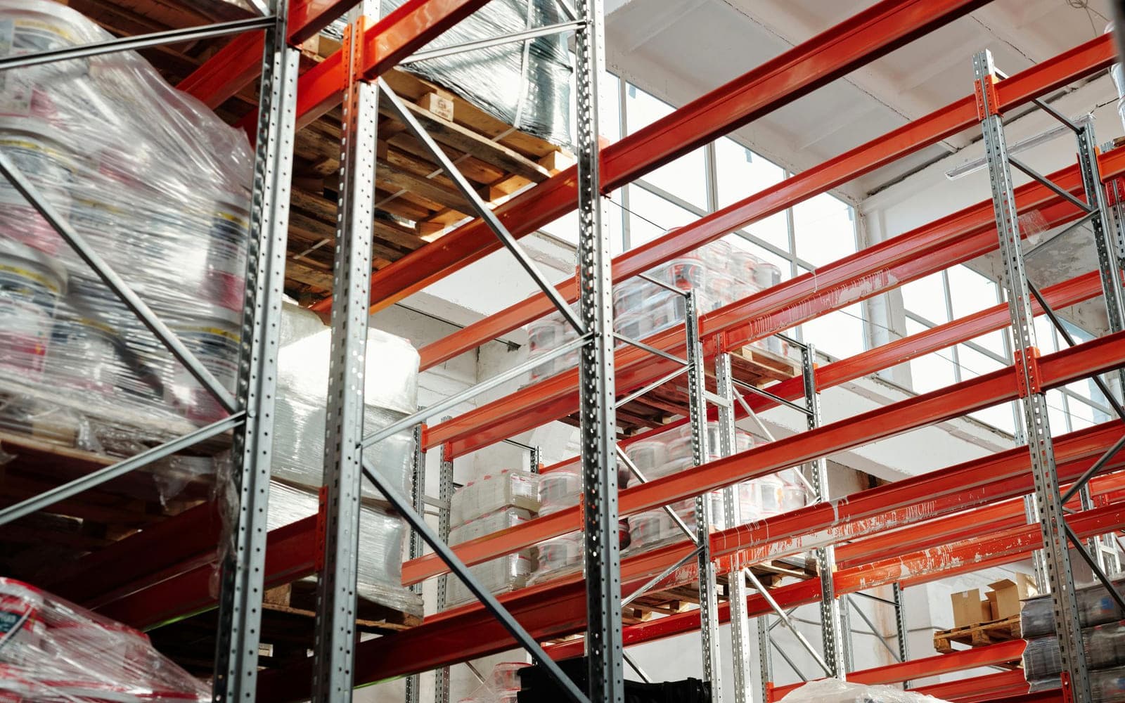 High-bay warehouse racking filled with palletised stock