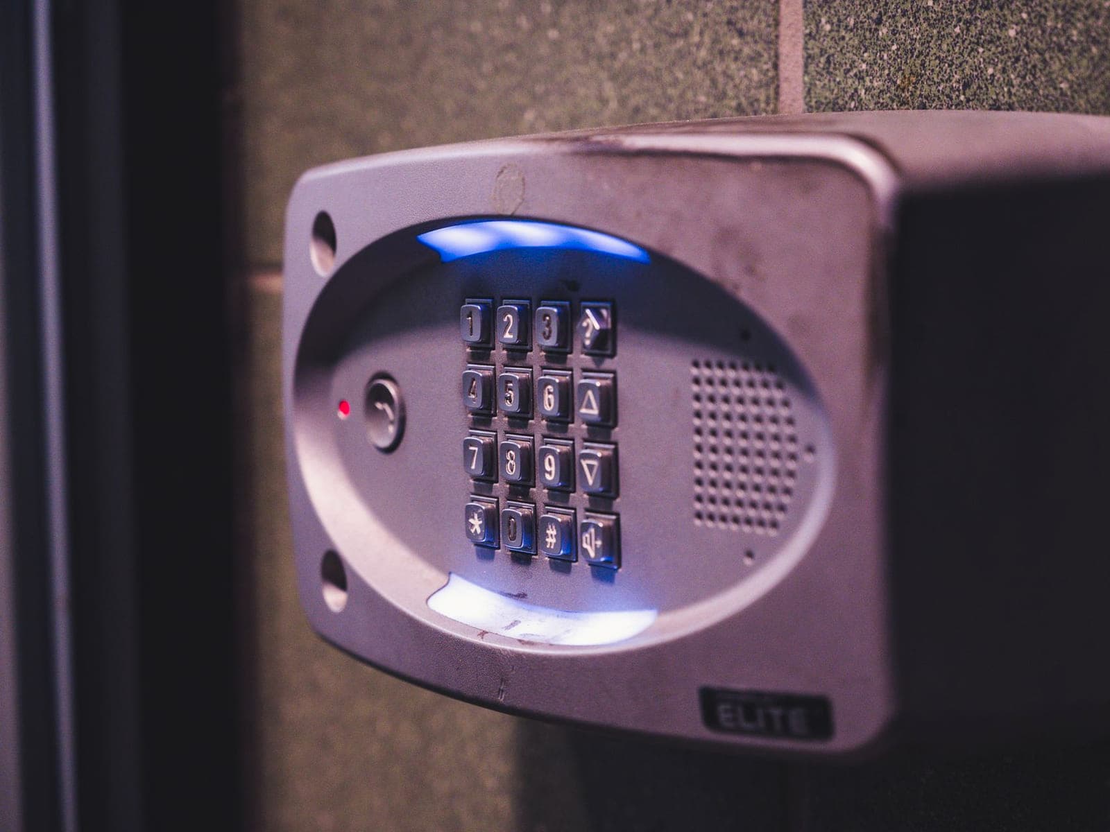 Access control reader and keypad mounted on a pedestal at a site entrance
