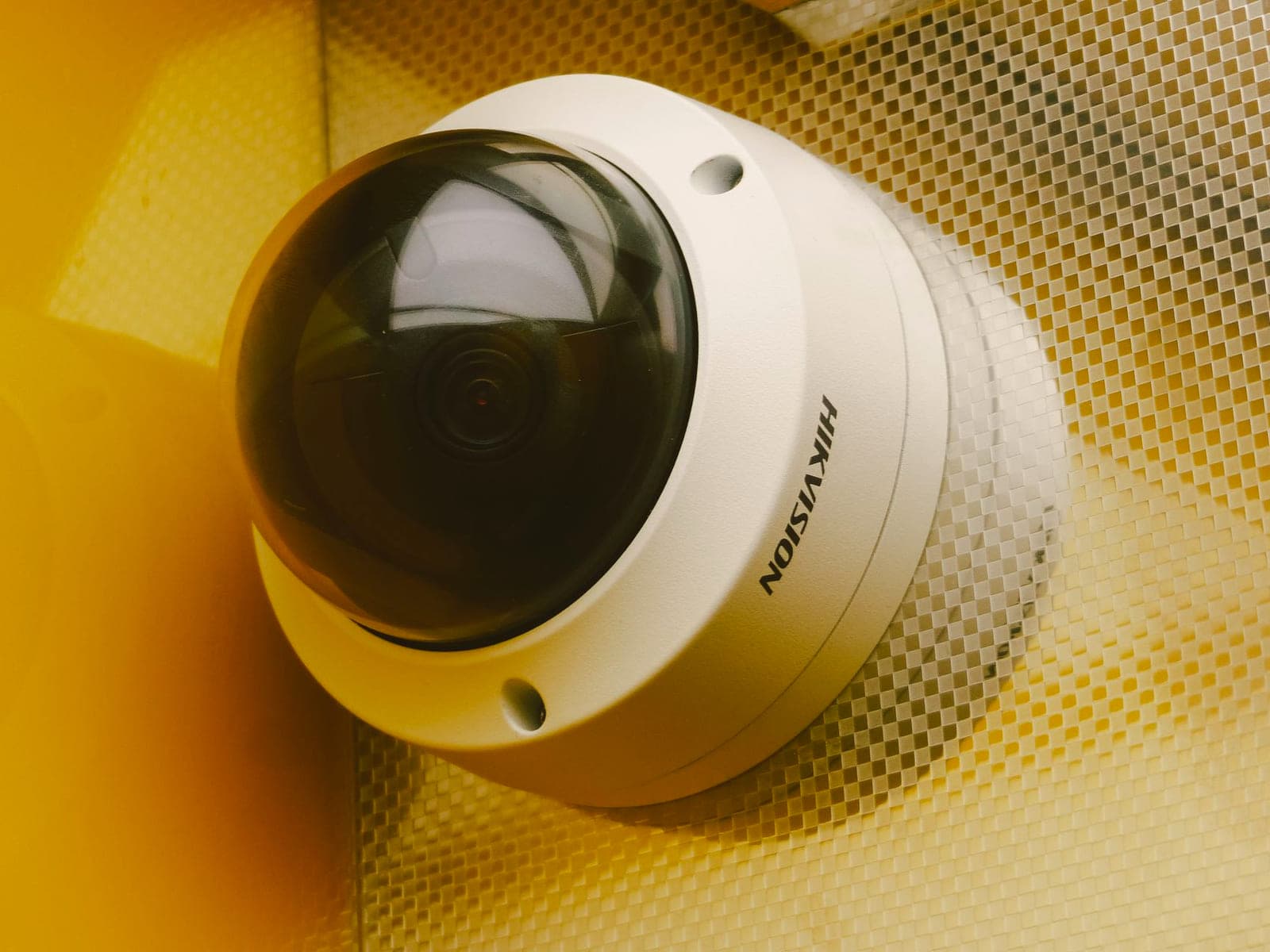 Two professional bullet CCTV cameras mounted on the exterior wall of a commercial building