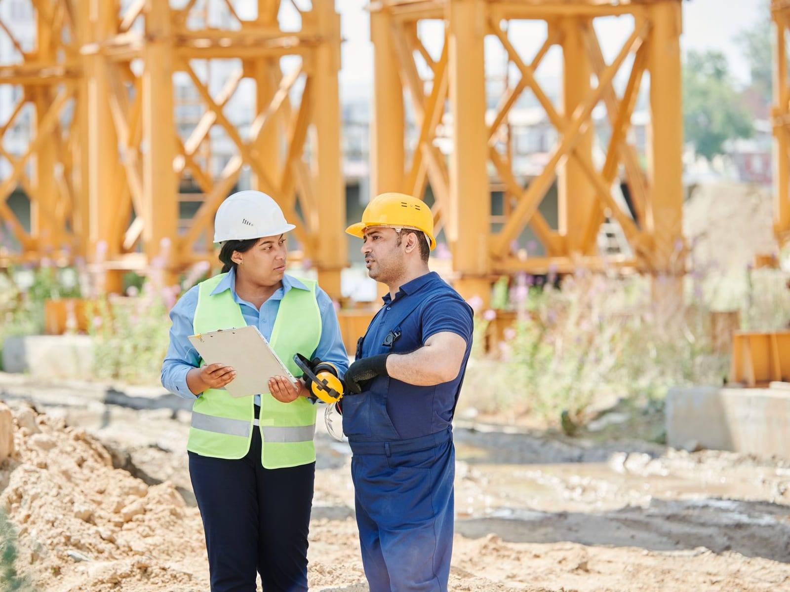 Engineers in hi-vis working together on a site