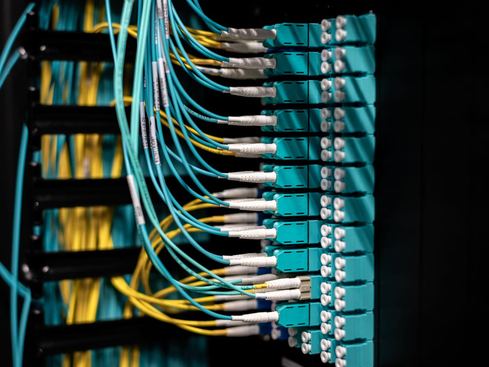 Server and network equipment mounted in a comms room cabinet