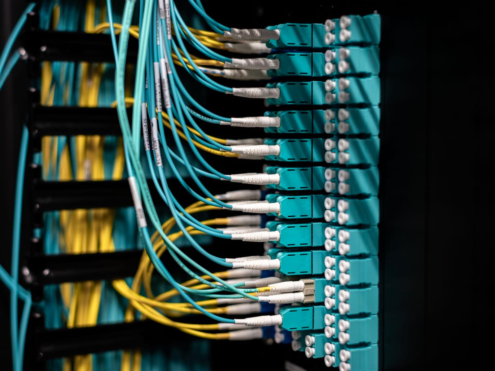 Server and network equipment mounted in a comms room cabinet