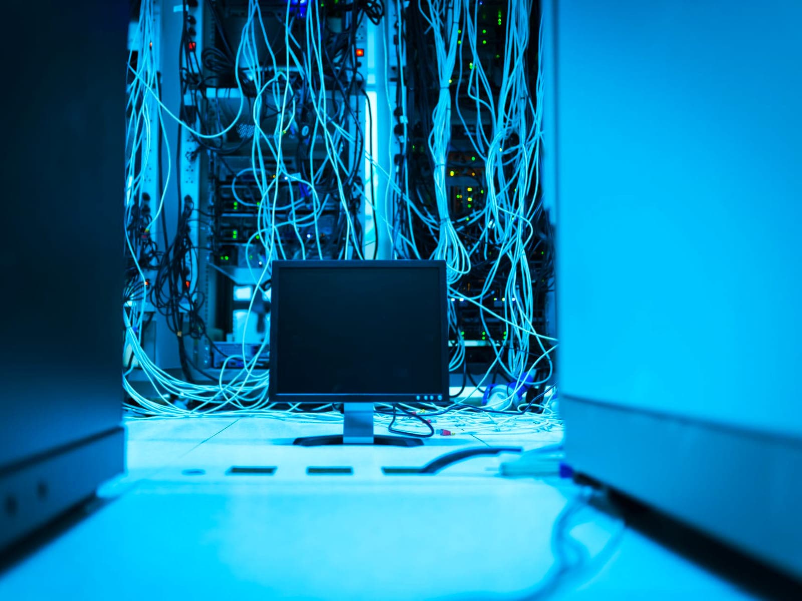 Close-up of a managed network switch with patched ethernet ports